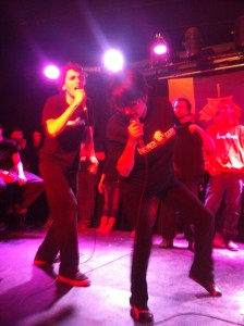 Players François Jean and Manon Chouinard delivering a song spoofing James Bond openings