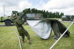 About 100 soldiers help with the crush of asylum seekers at Quebec border